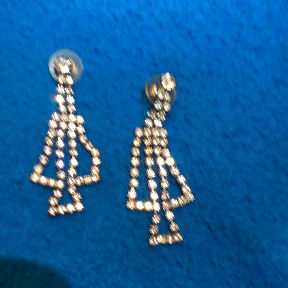 Earrings bought from sale for “Bodyguard” movie items, on Warner Bros lot.